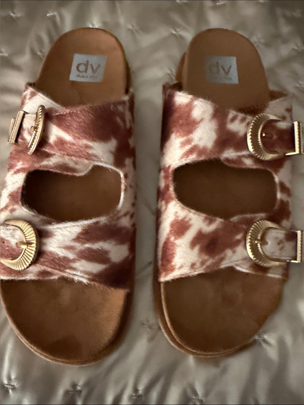 DV by Dolce Vita Brown and White Cow-Print Slide Sandals with Gold Buckles